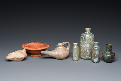 Four Roman glass bottles, two pottery oil lamps and a bowl