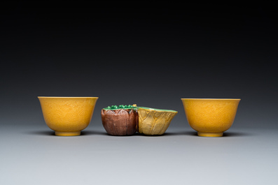 A Chinese sancai-glazed water dropper and a pair of yellow-glazed anhua 'dragon' bowls, Xianfeng mark, Kangxi and later