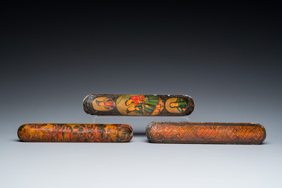 Three lacquered papier-mach&eacute; pen boxes or qalamdans, Qajar, Persia, 19th C.