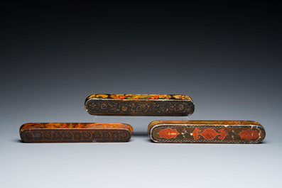 Three lacquered papier-mach&eacute; pen boxes or qalamdans, Qajar, Persia, 19th C.