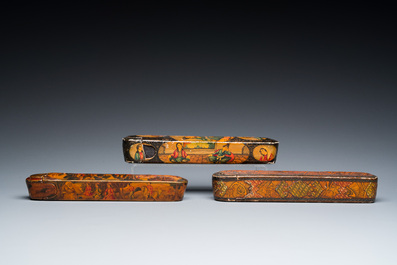 Three lacquered papier-mach&eacute; pen boxes or qalamdans, Qajar, Persia, 19th C.