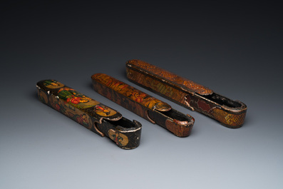 Three lacquered papier-mach&eacute; pen boxes or qalamdans, Qajar, Persia, 19th C.