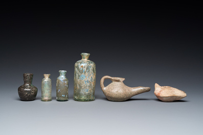 Four Roman glass bottles, two pottery oil lamps and a bowl