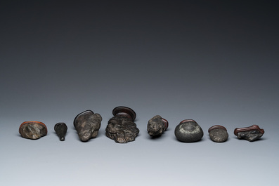 Eight Chinese 'gongshi or 'scholar's rocks' on wooden stands, Republic