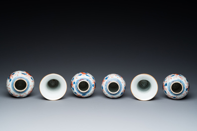 A Chinese Imari-style garniture of six vases with floral design, Kangxi