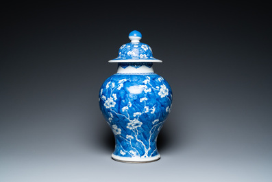 A Chinese blue and white 'prunus on cracked ice' vase and cover, Kangxi