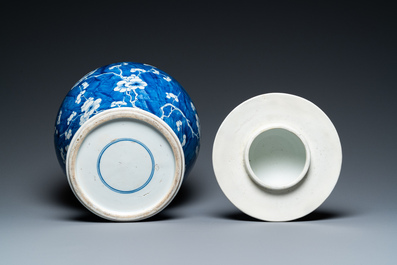 A Chinese blue and white 'prunus on cracked ice' vase and cover, Kangxi