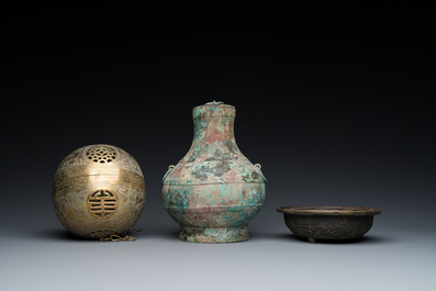 A varied collection of Chinese and Tibetan bronze, brass and wood objects, 19/20th C.