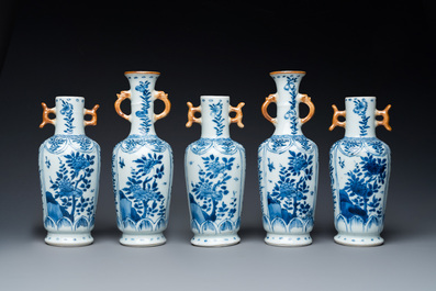 A Chinese blue and white garniture of five vases with floral design, Kangxi