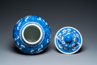 A Chinese blue and white 'prunus on cracked ice' vase and cover, Kangxi