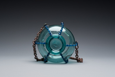 A light blue glass mosque lamp, Syria or Persia, 10th C.