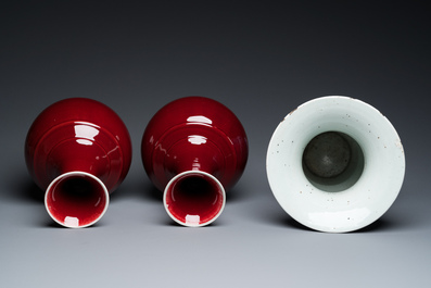 A Chinese blue and white 'Shou' vase with butterflies and a pair of sang-de-boeuf-glazed bottle vases, 19/20th C.