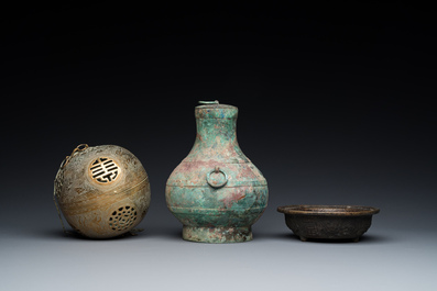 A varied collection of Chinese and Tibetan bronze, brass and wood objects, 19/20th C.