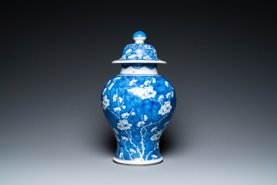 A Chinese blue and white 'prunus on cracked ice' vase and cover, Kangxi