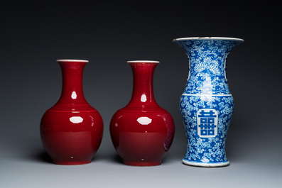 A Chinese blue and white 'Shou' vase with butterflies and a pair of sang-de-boeuf-glazed bottle vases, 19/20th C.