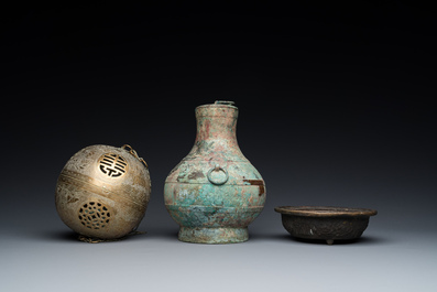 A varied collection of Chinese and Tibetan bronze, brass and wood objects, 19/20th C.