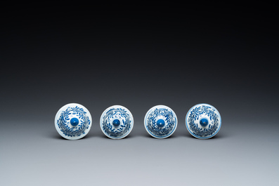 A Chinese blue and white garniture of six vases with floral design, Kangxi