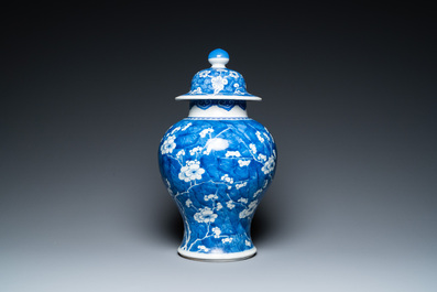 A Chinese blue and white 'prunus on cracked ice' vase and cover, Kangxi