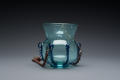 A light blue glass mosque lamp, Syria or Persia, 10th C.