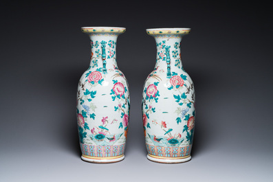 A pair of Chinese famille rose vases with peacocks and phoenixes, 19th C.