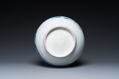 A Japanese blue and white bottle vase with a lady in a landscape, Edo, 17/18th C.
