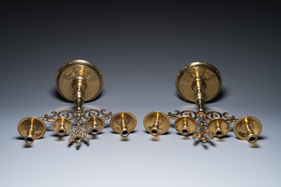 Three large Polish or Prussian bronze 'shabbat' candlesticks crowned with double eagles, 17th C.