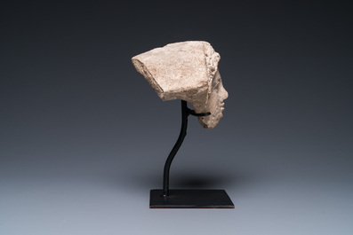 A Greek terracotta with white engobe antefix in the shape of a woman's head, 5/4th C. b.C.
