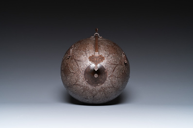 A Qajar tinned copper helmet (khula khud), shield (dhal) and arm piece (dastana), Persia, 19th C.