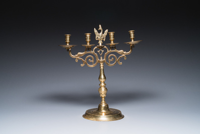 Three large Polish or Prussian bronze 'shabbat' candlesticks crowned with double eagles, 17th C.