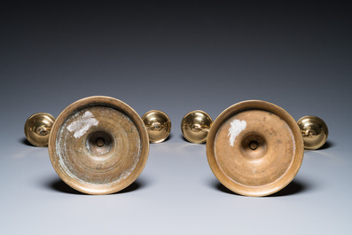 Three large Polish or Prussian bronze 'shabbat' candlesticks crowned with double eagles, 17th C.