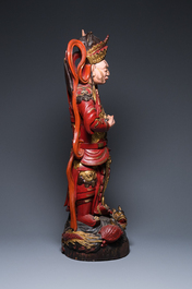 A large Vietnamese red-and-gilt-lacquered wood sculpture of a heavenly king, 19/20th C.