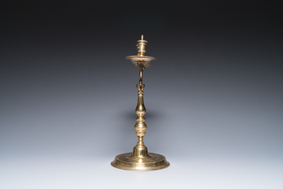 Three large Polish or Prussian bronze 'shabbat' candlesticks crowned with double eagles, 17th C.