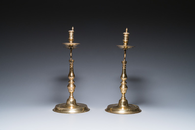 Three large Polish or Prussian bronze 'shabbat' candlesticks crowned with double eagles, 17th C.