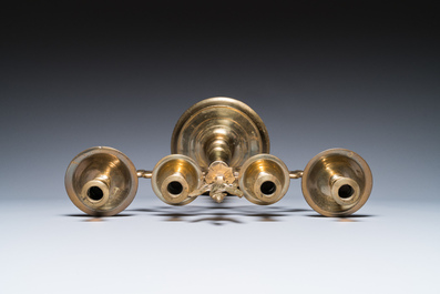 Three large Polish or Prussian bronze 'shabbat' candlesticks crowned with double eagles, 17th C.