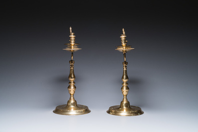 Three large Polish or Prussian bronze 'shabbat' candlesticks crowned with double eagles, 17th C.