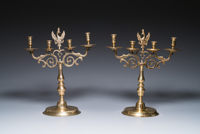 Three large Polish or Prussian bronze 'shabbat' candlesticks crowned with double eagles, 17th C.