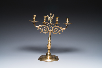 Three large Polish or Prussian bronze 'shabbat' candlesticks crowned with double eagles, 17th C.