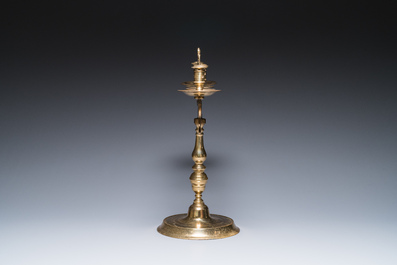 Three large Polish or Prussian bronze 'shabbat' candlesticks crowned with double eagles, 17th C.