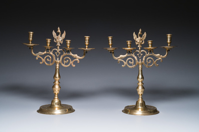 Three large Polish or Prussian bronze 'shabbat' candlesticks crowned with double eagles, 17th C.