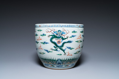 A Chinese blue and white celadon-ground vase, a pair of Nanking vases and a famille verte fish bowl, 19th C.