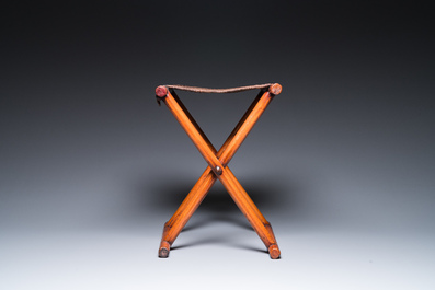 A Chinese wooden mirror and a foldable stool, 19/20th C.