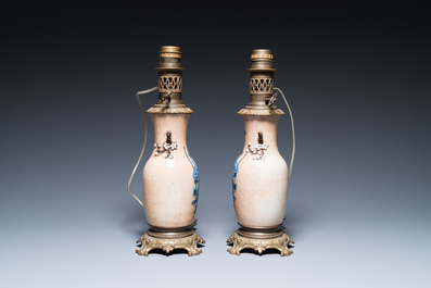 A Chinese blue and white celadon-ground vase, a pair of Nanking vases and a famille verte fish bowl, 19th C.