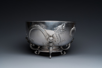 A large Chinese silver bowl resting on three dragon feet, marked for Kun He, Shanghai, 19/20th C.