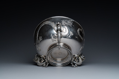 A large Chinese silver bowl resting on three dragon feet, marked for Kun He, Shanghai, 19/20th C.