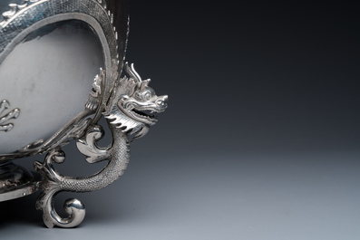 A large Chinese silver bowl resting on three dragon feet, marked for Kun He, Shanghai, 19/20th C.