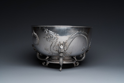 A large Chinese silver bowl resting on three dragon feet, marked for Kun He, Shanghai, 19/20th C.