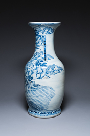 A large Chinese blue, white and copper-red vase with a mountainous river landscape, 19th C.