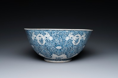 A very fine and rare Dutch Delft blue and white bowl with grotesques in the style of Daniel Marot, dated 1720