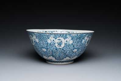 A very fine and rare Dutch Delft blue and white bowl with grotesques in the style of Daniel Marot, dated 1720
