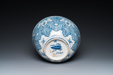 A very fine and rare Dutch Delft blue and white bowl with grotesques in the style of Daniel Marot, dated 1720